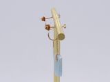 a gold plated pen with a blue stone on top of it