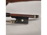 a close up of a bow on a table with a knife