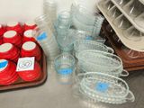 many cups and containers on the table ready to be used