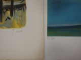 an open book with a drawing of a boat and a painting of a tree