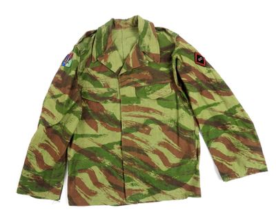 a green and brown camouflage jacket on a white background