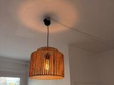 a lamp that is hanging from the ceiling in a room