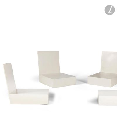 three white chairs and a table on a white surface
