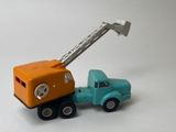 a toy truck with a crane attached to the back of it