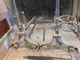 a fire place that has a bunch of tools on it