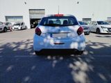 a white car that is parked in a parking lot