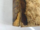 an old book that has been left open on the table