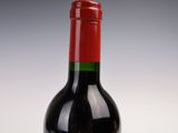 a bottle of wine that is sitting on a table