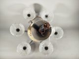 overhead view of a chandelier made of glass with a clock on it
