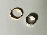 two rings that are sitting on a table