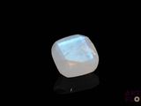 an image of a white oplite stone on a black surface