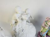 three figurines that are sitting on a table
