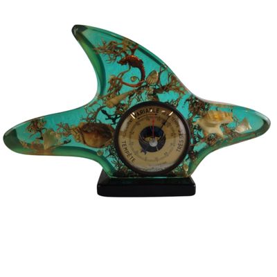turquoise and gold starfish clock on a black stand