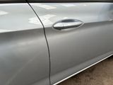a silver car parked on the side of the road