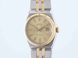 an image of a lady ' s rolex watch with two tone bracelets