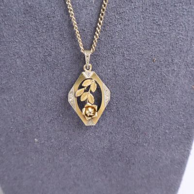 a close up of a necklace on a mannequin mannequin