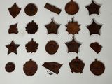 several pieces of chocolate are arranged in a circle on a white surface