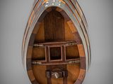 a close up of a wooden wine barrel with a wine rack
