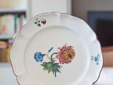 a white plate with a floral design on it