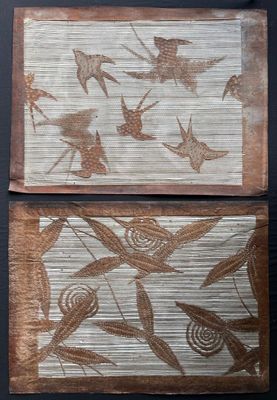 two paintings of birds and flowers on a wall with a black background