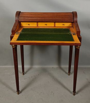 an image of a small desk with a drawer on top of it
