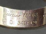 a close up of a silver ring with a name engraved on it