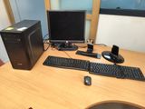 a desktop computer sitting on a desk with a keyboard and mouse