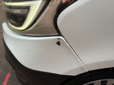 a car that has been dented and has a denting on it