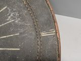 a close up of a clock on a white table