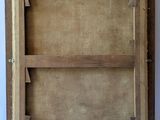 an old picture frame with a wooden shelf on the wall