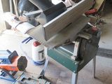 a picture of a table saw in a garage