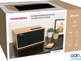 a box with a picture of a wooden speaker on it
