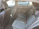 the back seats of a car are black with a red tag on it