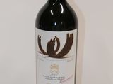 a bottle of wine that is sitting on a table