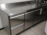 a stainless steel kitchen with a microwave and a dishwasher