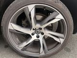 a close up of a tire on a black car