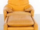 an image of a yellow leather chair and ottoman in a room