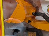 a toy machine that has a construction vehicle inside of it