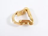 a close up of a gold ring on a white surface