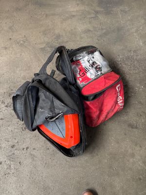 a person standing next to a bag of luggage on the ground