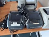 two printers and a printer sitting on a table