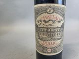 a bottle of wine that is sitting on a table