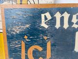 a sign that says ice on the side of a building