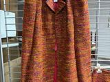 a close up of a jacket and skirt on display in a store