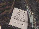 two tags on a piece of plastic on a table