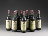 six bottles of wine are lined up in a row on a table