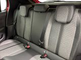 the back seats of a car with two rows of seats in it