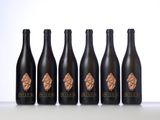 six bottles of six different types of wine on a table