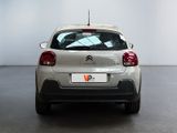 the back of a silver car with a number plate on the back of it