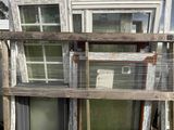 many old windows stacked on top of each other